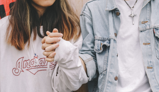 teenagers holding hands